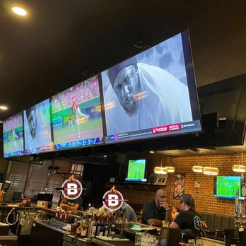 Bare Bones Grill and Bar - Lots of tvs! Four more big tvs back up to these. See two more on the wall. Five more not shown here! - Barbeque Near Me - Ellicott City, Maryland
