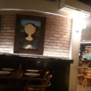 Forneria Catarina - Inside view from my table. I love the rendition of the Mon Lisa and Frida Kahlo. - Pizza Near Me - Florianópolis, South Carolina