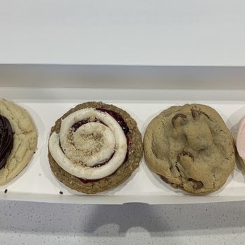 Crumbl - New Braunfels - Left to right - chocolate cupcake triple berry cobbler, chocolate chip and classic pink sugar. - Bakeries Near Me - New Braunfels, Texas Crumbl - New Braunfels - Left to right - chocolate cupcake triple berry cobbler, chocolate chip and classic pink sugar. - Bakeries Near Me - New Braunfels, Texas