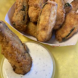 HAND CUT AND BATTERED DEEP FRIED ZUCCHINI FRYS WITH IN HOUSE HAND MADE RANCH DRESSING