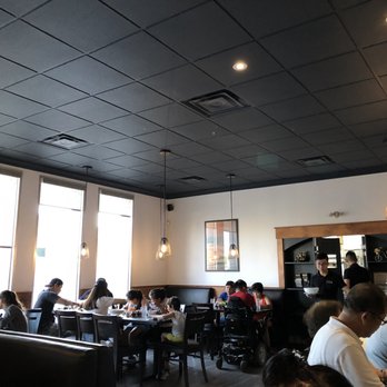 Pho Binh Minh Vietnamese Cuisine - The interior of Pho Binh Minh, notable for its black decor and includes booths and open space table areas. - Vietnamese Near Me - Hamilton, Ontario Pho Binh Minh Vietnamese Cuisine - The interior of Pho Binh Minh, notable for its black decor and includes booths and open space table areas. - Vietnamese Near Me - Hamilton, Ontario