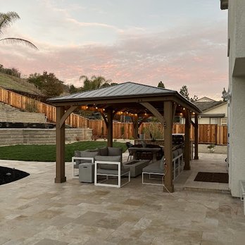Premier Landscape - a patio with a pergol roof - Landscaping Near Me Premier Landscape - a patio with a pergol roof - Landscaping Near Me