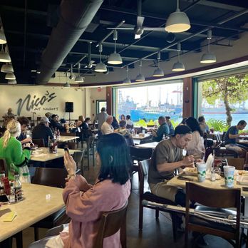 Nico's Pier 38 - Dining area with a view of the harbor. - Seafood Near Me - Honolulu, Hawaii