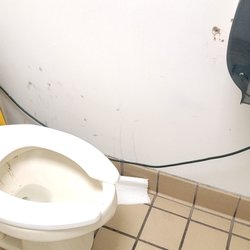 Dunkin' - Public toilet and walls near them.