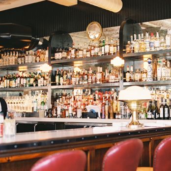 Walloon's Restaurant - a bar filled with bottles of liquor - Seafood Near Me - Fort Worth, Texas Walloon's Restaurant - a bar filled with bottles of liquor - Seafood Near Me - Fort Worth, Texas