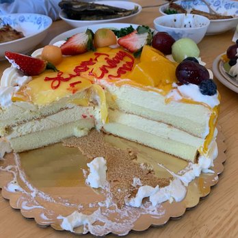 May's Cake House - Mango Mousse Cake: inside layers, alternating sponge and mousse layers - Bakeries Near Me - Boston, Massachusetts