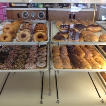 Sunshine Donut - a variety of doughnuts in a display case - Donuts Near Me - Oxnard, California