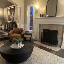 First and Main Design Market - Living room design with a leather accent chair and stunning black coffee table