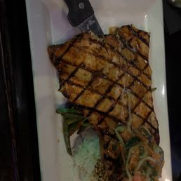 Swordfish with a chili glaze, rice, green beans, and cucumber salad.