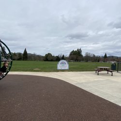 Fir Grove Park - Behind the playground and grassy area with soccer goals, you'll find a tree-lined path that follows along the river.