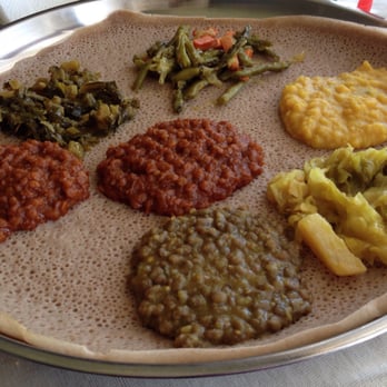 Gojo Ethiopian Restaurant - Veggie Combo: 9 o'clock, the 2 reddish items are Misir Wot; Gomen; Fosolian; Ater Kik (gross!); Tikil Gomen; & the mystery dish - Ethiopian Near Me - Phoenix, Arizona Gojo Ethiopian Restaurant - Veggie Combo: 9 o'clock, the 2 reddish items are Misir Wot; Gomen; Fosolian; Ater Kik (gross!); Tikil Gomen; & the mystery dish - Ethiopian Near Me - Phoenix, Arizona