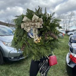 Snickers Gap Christmas Tree Farm - Decorated wreath with pines.