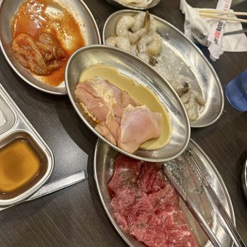 Jongro BBQ Market - Iron steak, marinated chicken thighs, marinated shrimp, and spicy mini octopus - Korean Near Me - New York, New York Jongro BBQ Market - Iron steak, marinated chicken thighs, marinated shrimp, and spicy mini octopus - Korean Near Me - New York, New York