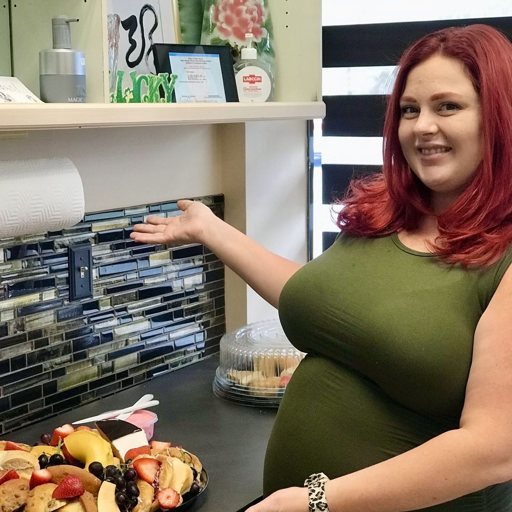 a pregnant woman in a kitchen a pregnant woman in a kitchen