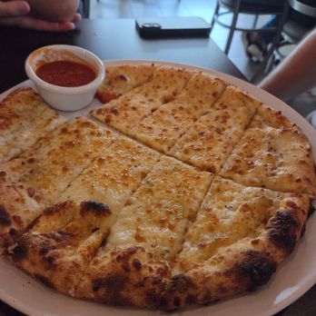 Vicino’s Brick & Brew - Cheesy garlic bread with marinara on the side. - Cocktail Bars Near Me - Syracuse, New York
