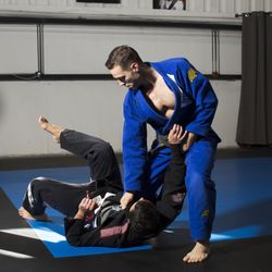 Industrial Strength: Fitness & Jiu Jitsu - Coach Tony demonstrating a takedown in Jiu Jitsu