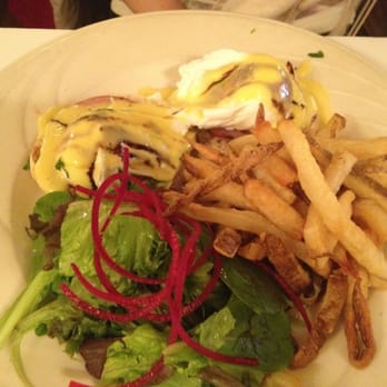 Deux Amis - eggs benedict served with pommes frites and mixed greens - French Near Me - New York, New York Deux Amis - eggs benedict served with pommes frites and mixed greens - French Near Me - New York, New York