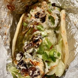 Pita sandwich with spicy BBQ chicken and all the toppings