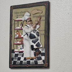 Villa Pizzeria - A framed chef artwork.