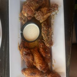 Award Winning Wings half blackened half garlic Parmesan Award Winning Wings half blackened half garlic Parmesan