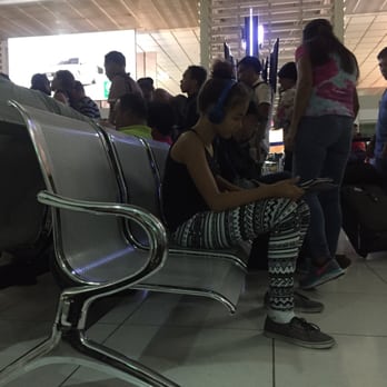 NAIA Terminal 2 - The line to board.  Peope don't follow directions and get in line even thought their section has not been called. - Airport Terminals Near Me - Pasay, NCR