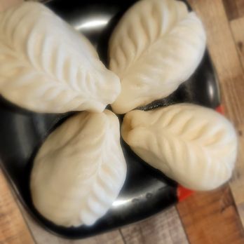 MyungIn Dumplings - Humongous Vegi dumplings on fluffy bao type skin.  Bad photo - Korean Near Me - Buena Park, California