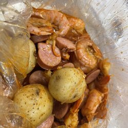 Juicy Tails - Rogers - Shrimp, sausage & potato broil with garlic seasoning.  Delish!
