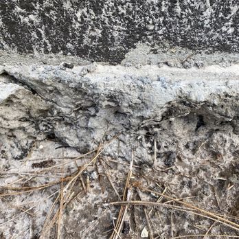 Ashton Woods - Parged concrete from foundation a mess. Changed pine needles to mulch, chunks concrete coming off wall leaving uneven foundation - Real Estate Services Near Me