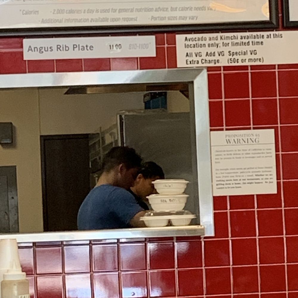 Proof that the cook is not wearing a uniform nor a hair net or hat. Proof that the cook is not wearing a uniform nor a hair net or hat.
