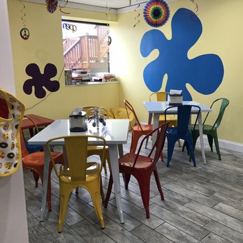 Peace Love and Little Donuts - More of the seating in the cute shop. - Donuts Near Me - Avon, Ohio