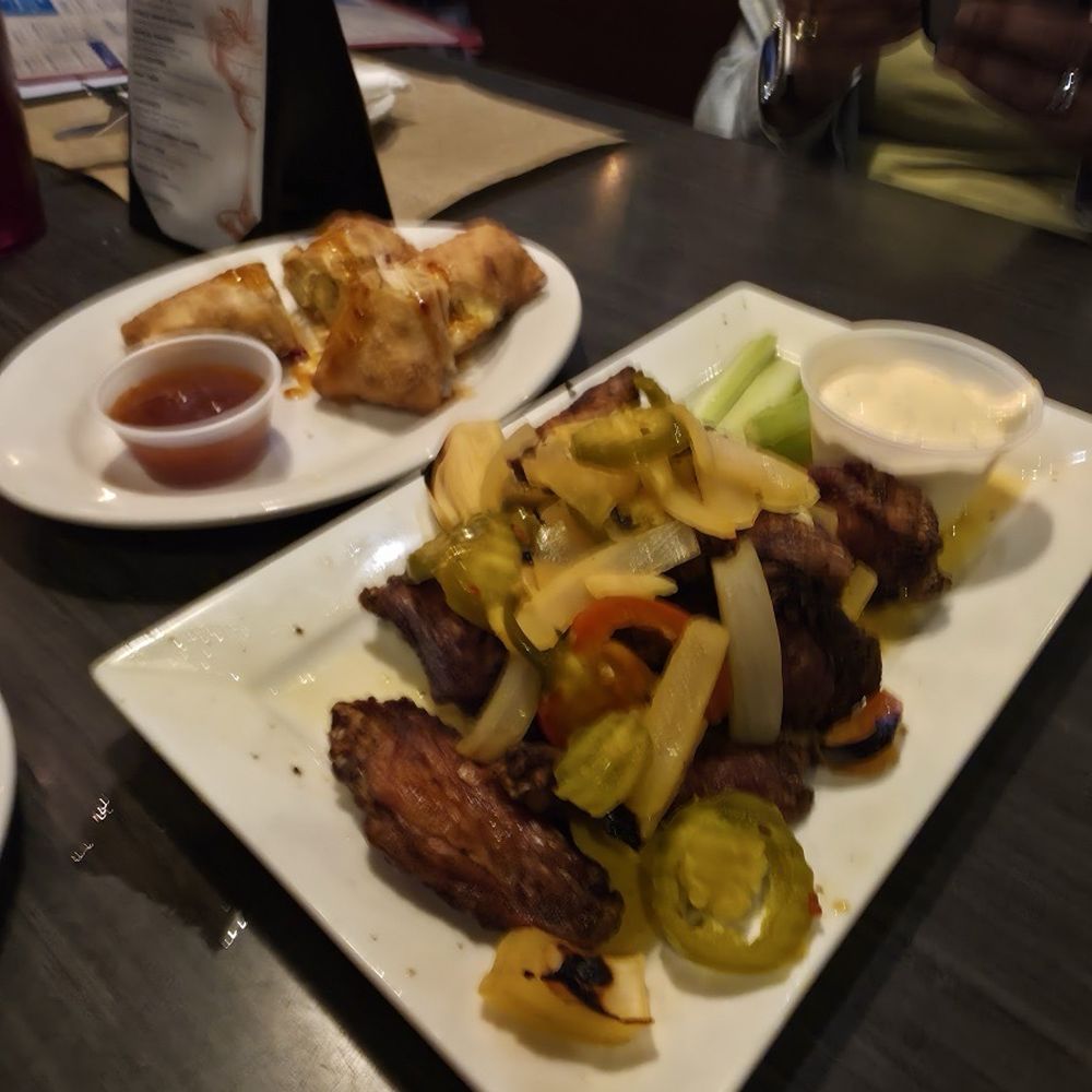 Benny the Bum's - Black Baked Cherry Pepper Wings and crab cake egg rolls - American Near Me - Philadelphia, Pennsylvania