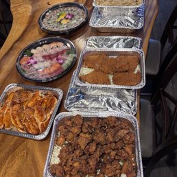 Furikake Chicken, teriyaki salmon, tonkatsu, fried rice, and two sushi platters Furikake Chicken, teriyaki salmon, tonkatsu, fried rice, and two sushi platters