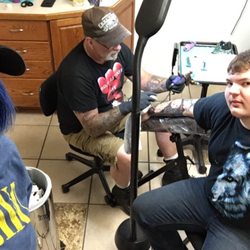 Dark Horse tattoo - Pat hard at work creating a masterpiece for this clients sleeve.