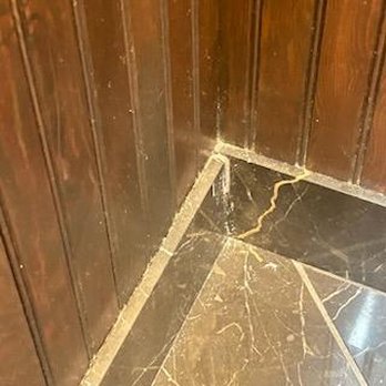Gaslight Inn - Filth on top of baseboard in the bathroom - Bed & Breakfast Near Me - Seattle, Washington