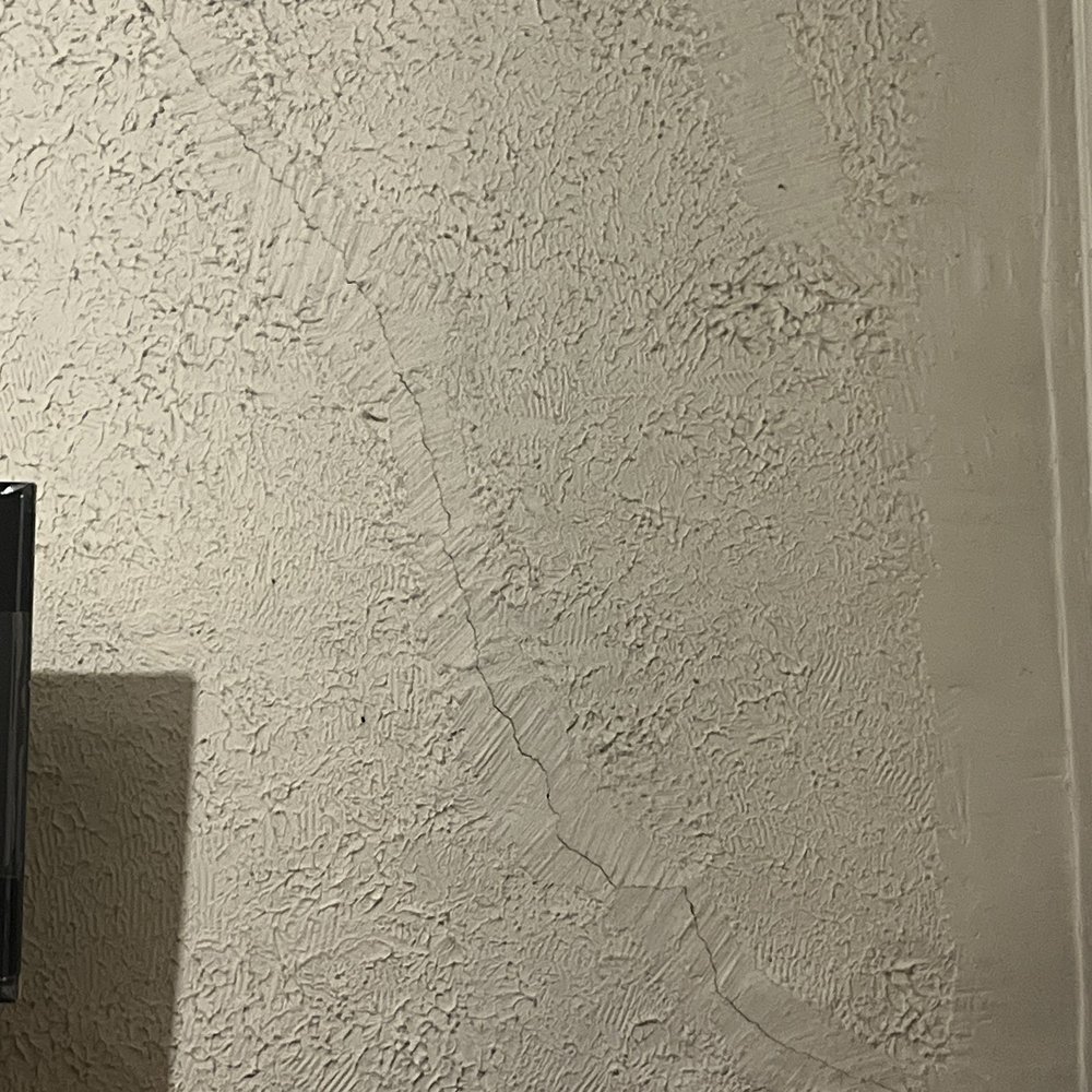 Chelsmore Apartments - Cracked wall in bedroom - Apartments Near Me - New York, New York