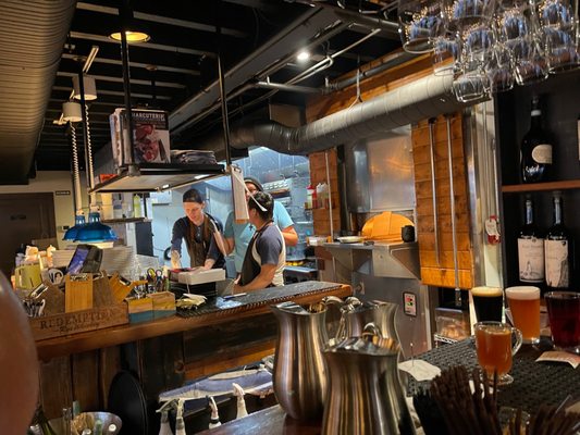 Photo of The White Swan Public House - Seattle, WA, US. a man and a woman behind a bar