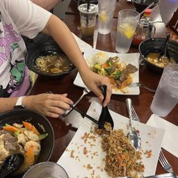 people eating at a restaurant people eating at a restaurant