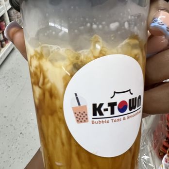 K-TOWN - a person holding a cup of iced coffee - Korean Near Me - Plantation, Florida