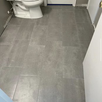 Anointed Handz - a white toilet in a bathroom - Flooring Near Me