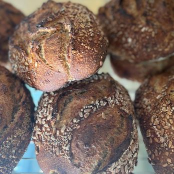Jens Artisan - a close up of a bunch of breads - Bakeries Near Me - Rochester, New York