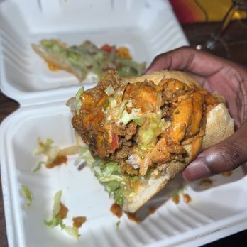 Voodoo Vegan - a hand holding a sandwich in a styrofoam container - Vegan Near Me - Los Angeles, California Voodoo Vegan - a hand holding a sandwich in a styrofoam container - Vegan Near Me - Los Angeles, California