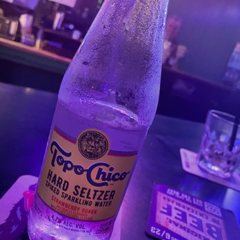 Shamrock Club - a bottle of hard seltzer on a table - New American Near Me - Chicago, Illinois Shamrock Club - a bottle of hard seltzer on a table - New American Near Me - Chicago, Illinois