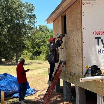 Treviño Construction - two men working on a house - General Contractors Near Me