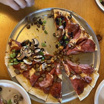Prospect Pizza - a pizza with several slices missing - Pizza Near Me - Prospect, Oregon