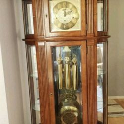 Benjamin & Sons Clock Service Center - Ridgeway curio cabinet Grandfather Clock with moon-dial..