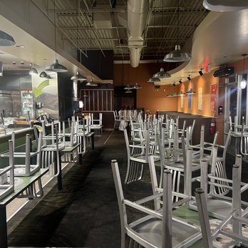 Garbanzo - a restaurant with tables and chairs - Mediterranean Near Me - Englewood, Colorado