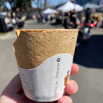 Balance Me Out - a hand holding a paper cup - Coffee & Tea Near Me - Sacramento, California