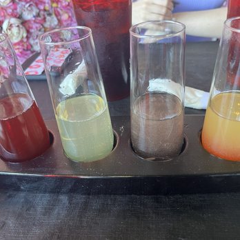 Mi Mosa - Flight of Mimosa  Blushing Mimosa, lavender glitter mimosa, lemon zest Mimosa, and Pomegranate Mimosa - Breakfast & Brunch Near Me - Farmington, Michigan