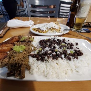 Nico's Arepas Grill - Pabellon dish and Cachapa with queso blanco.  Green (their version of wasacaca) - Venezuelan Near Me - Tampa, Florida