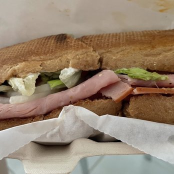 Firehouse Subs - a close up of a sub sandwich - Fast Food Near Me - Hallandale Beach, Florida
